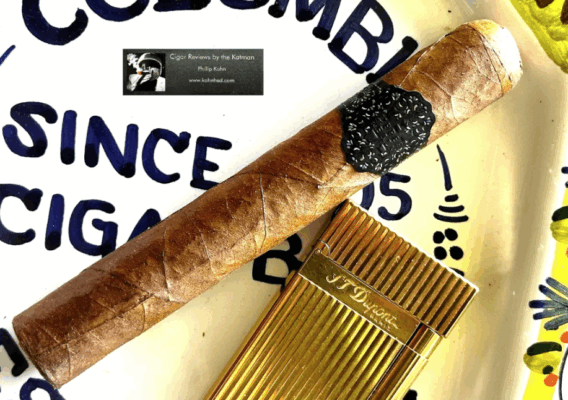 Cigar and gold cutter on table