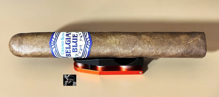 Katman Rekap ~ Crowned Heads Belgian Blue L.e. 2024 | Cigar Reviews By The Katman Cigar resting on a cutter