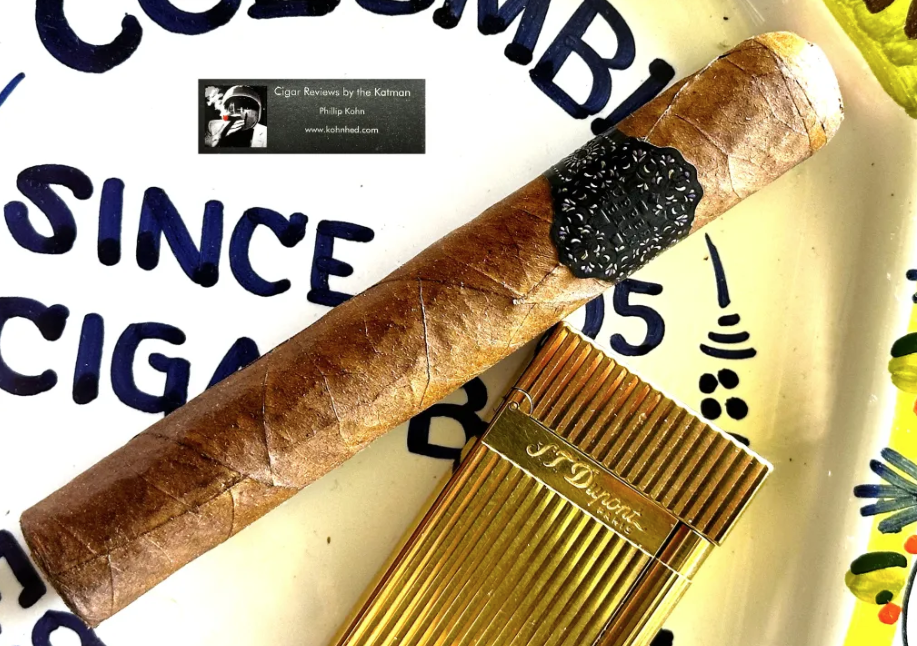 Katman Rekap ~ Warped Upper Realm (2022) | Cigar Reviews By The Katman Cigar and gold cutter on table